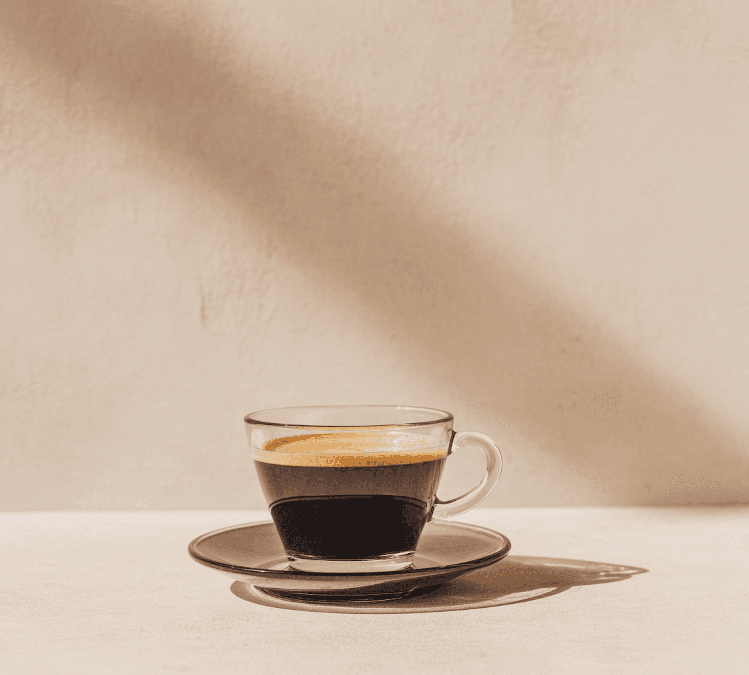Espresso with golden crema in a glass cup