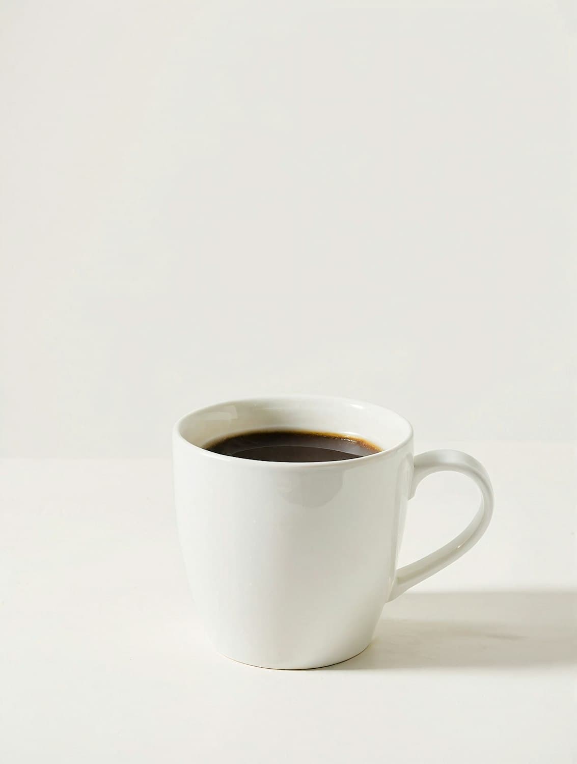 Black filter coffee in a white ceramic mug